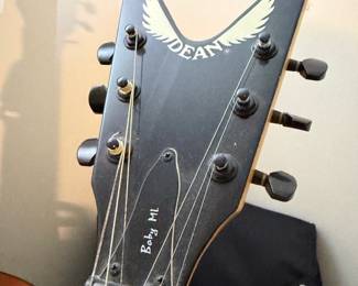 Dean electric guitar headstock with wings logo