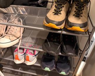 Shoe rack with hiking boots and athletic sneakers