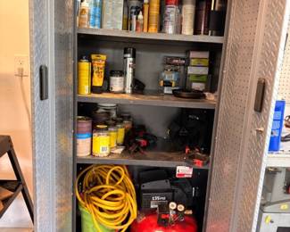 Garage cabinet with tools, paint, and Porter Cable air compressor
