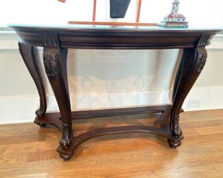 Ornate carved wood demilune console table