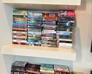 DVD and book collection on shelves