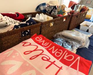 Baskets of seasonal holiday linens and decor