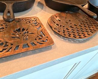 Decorative cast iron trivets and skillet