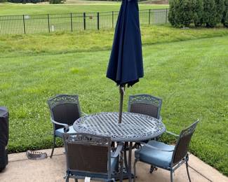 Cast aluminum patio dining set with umbrella and 4 chairs