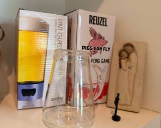 Pint glasses set, beer pong game, and figurine