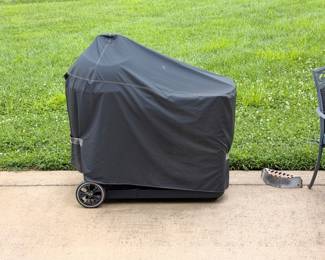 Outdoor grill with fitted cover