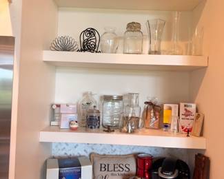 Kitchen shelf with glass canisters and Keurig coffee maker