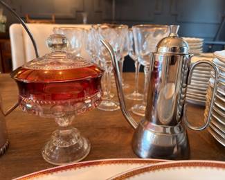 Cranberry glass covered compote and silver coffee pot