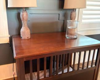 Pair of wood table lamps on slatted console table