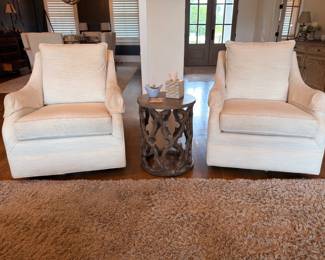 Pair of cream upholstered club chairs with metal side table