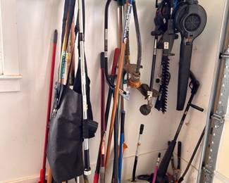 Yard tools, rakes, shovels, and leaf blower