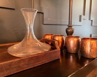 Glass wine decanter and hammered copper mule mugs