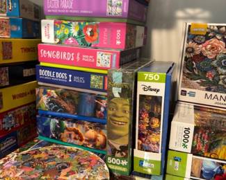 Large stack of jigsaw puzzles