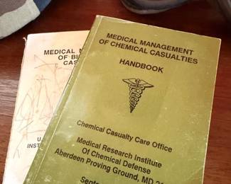 Military medical handbooks and gas mask