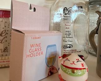 Wine glass holder, glass jug, and lucky cat figurine