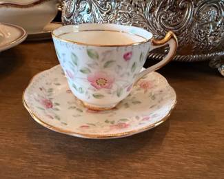 Floral bone china teacup and saucer, gold trim