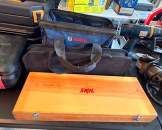 Bosch and Skil power tools in cases and bags