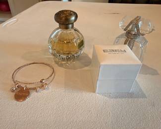 Perfume bottles and silver charm bracelet