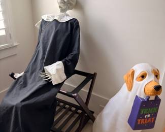 Halloween decor, life-size skeleton and trick-or-treat dog