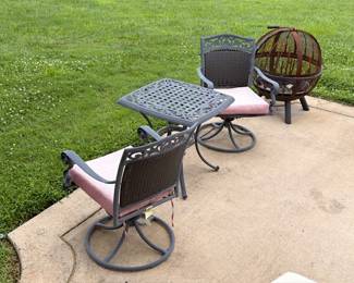 Patio swivel chairs, side table, and fire pit