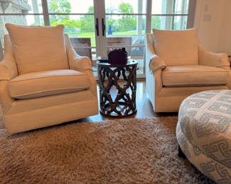 Pair of gold upholstered club chairs with metal side table