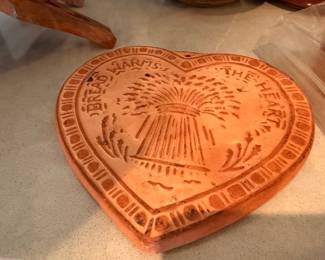Terracotta heart-shaped bread warmer