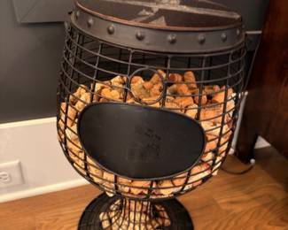 Metal goblet-shaped wine cork holder with corks