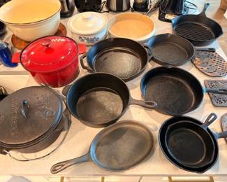 Cast iron skillet and Dutch oven collection with red enamel pot