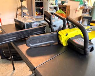 Ryobi and DeWalt chainsaws on table saw