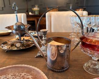 Silverplate pitcher, candlesticks, and cranberry glass