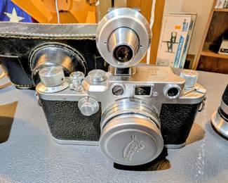 1940s Leica IIIc Camera Outfit – Serial 408398. Includes Leitz Summitar 5cm f/2 lens, Leitz Elmar 9cm f/4 lens, Leitz universal finder, filters and cases. Shutter, focus, apertures and rangefinder tested mechanically without film.