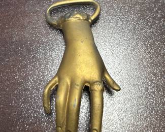 Brass hand bottle opener, 50s