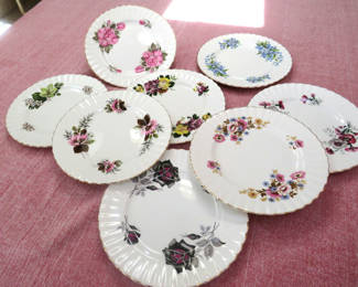 Lot 40: 8 Royal Ascot Bone China floral plates with Gold Trim