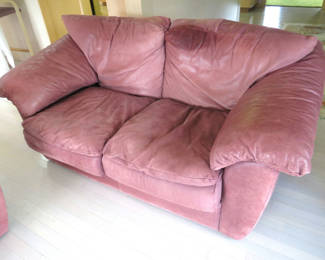 Lot 27: Leather tech leather love seat