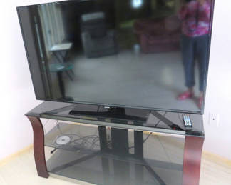 Lot 37: 55"Samsung tv with remote and Palantir glass tv stand