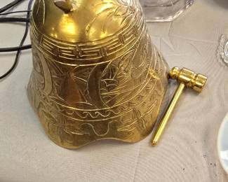 large brass gong with striker