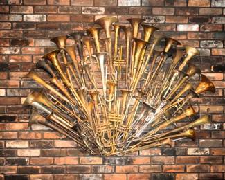 Arman "Eventail", 1995, Fan-shaped accumulationof sliced brass trombones