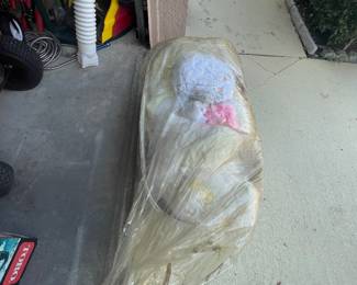 Vintage baby bassinet and clothing.