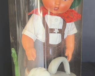 Lot 58: Vintage Baby Doll with Garden Accessories in Clear Cylinder