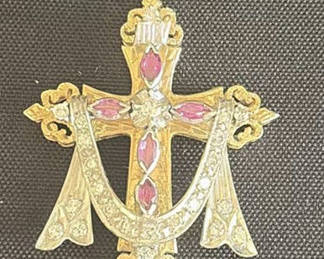 Lot 55: Ornate gold-tone cross pendant with pink stones