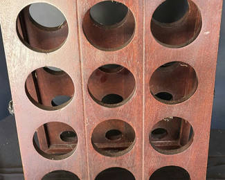 Lot 36: Two-panel wooden wine rack with twelve circular slots