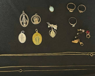 Lot 29: Assorted religious medals, rings, charms, and chains