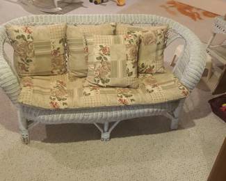 White Wicker Loveseat with Floral Patchwork Cushions