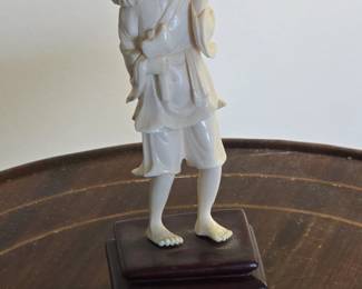Carved Ivory Figure of a Farmer with a Bundle