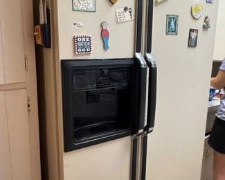 refrigerator with water and ice in door