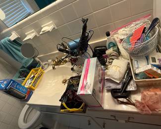 misc toiletries, curing irons, hair dryers, etc