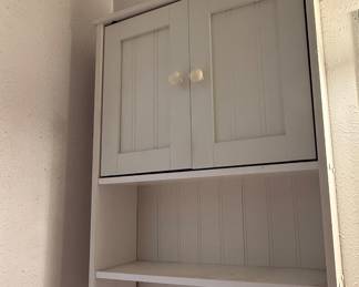 white wall shelf with drawers