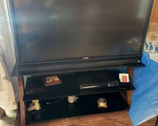 wide screen TV with glass shelf console