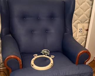 blue fabric chair with matching ottoman