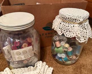 large jars with thread spools and buttons